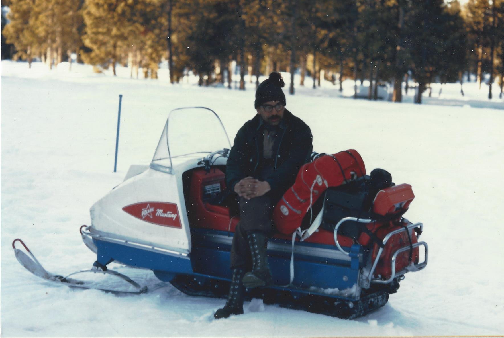 Bill Gabriel on snowmobile in winter forest