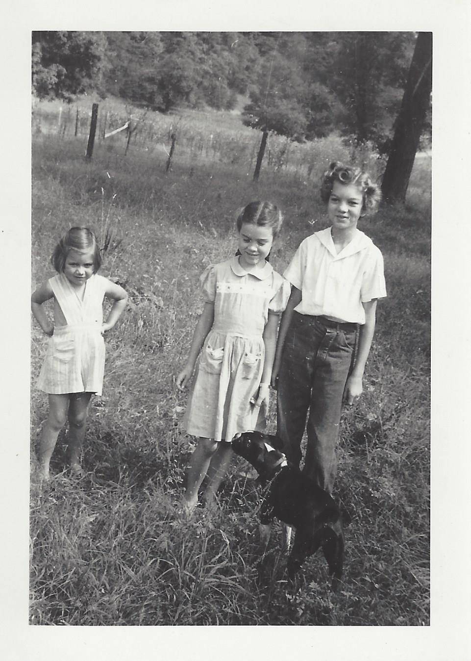 Carolyn with sisters in field