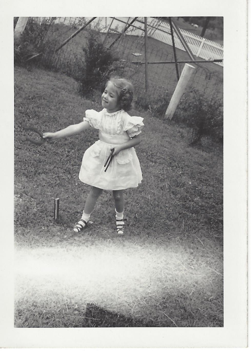 Young Diane playing in the yard
