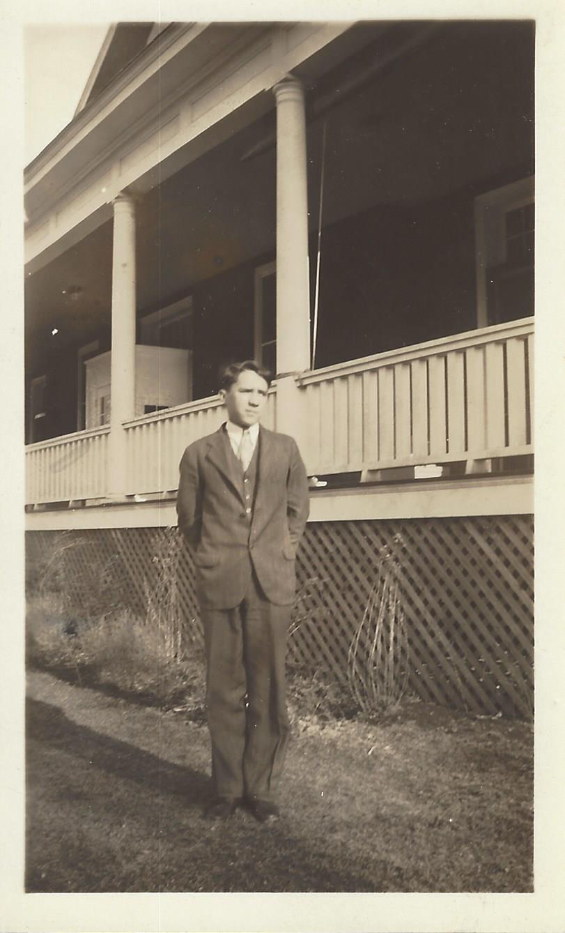 Young Harry in suit at Sun Rise porch