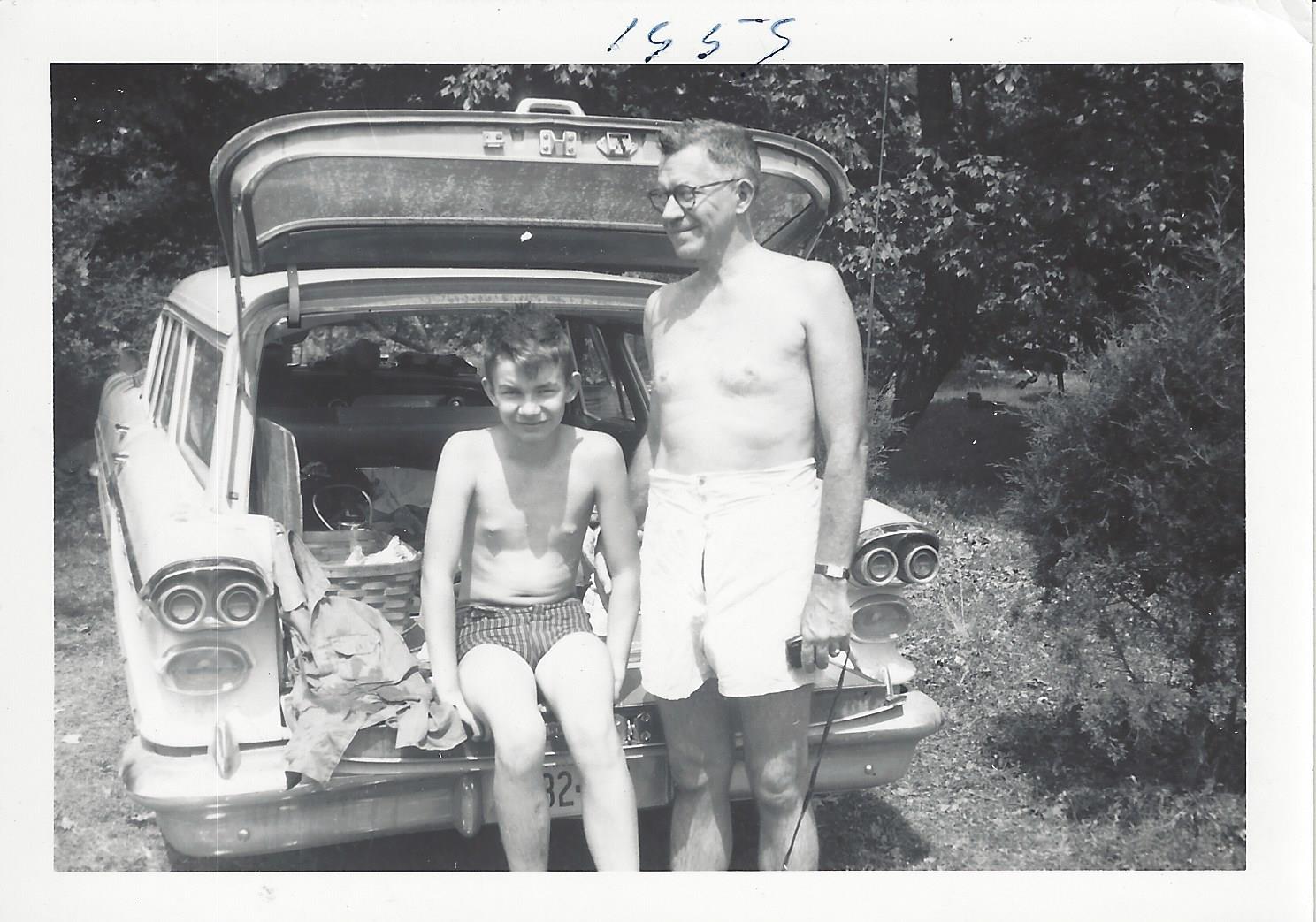 Julian with young Pete by the car, 1955