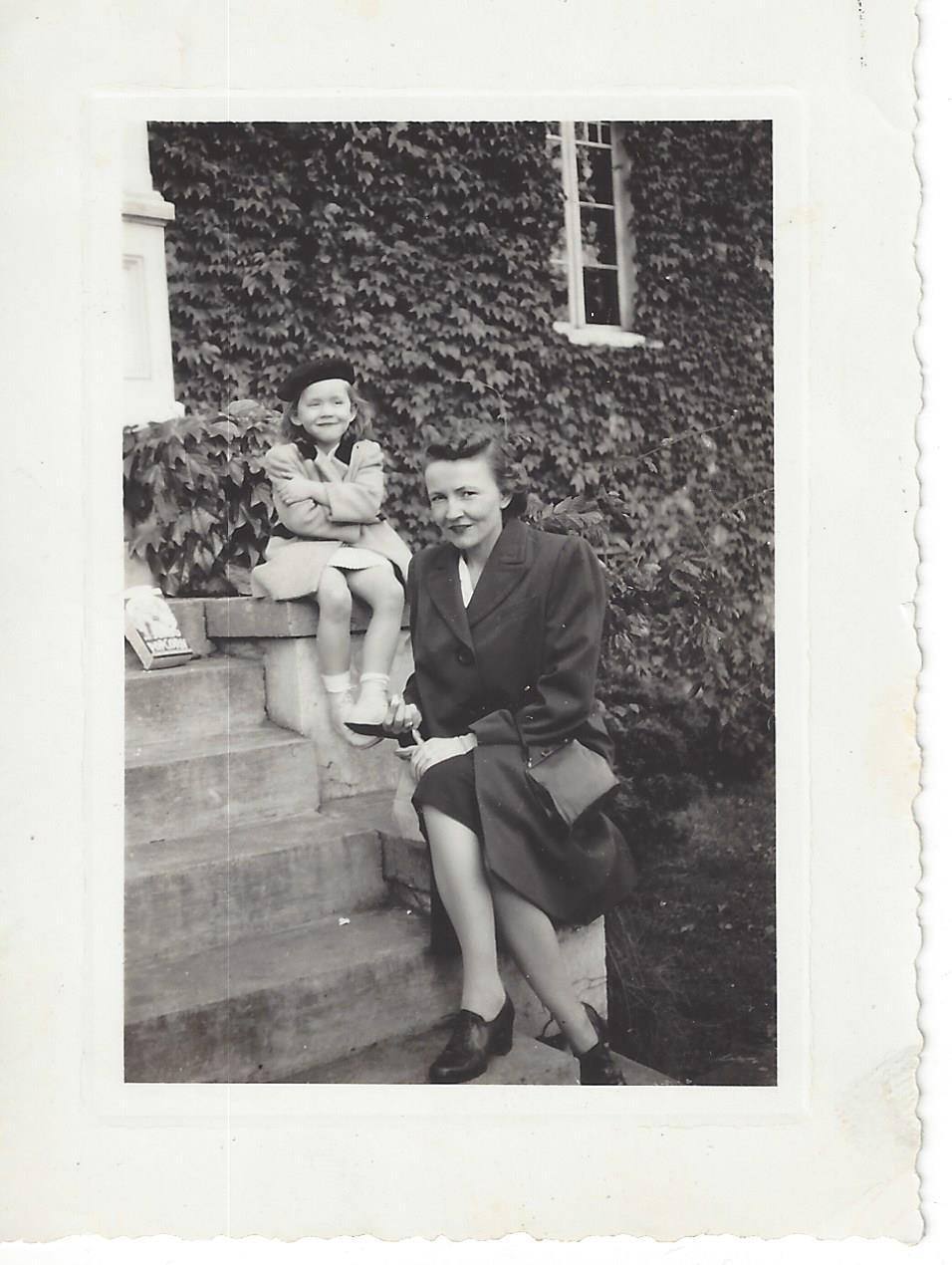 Neva with child on front steps