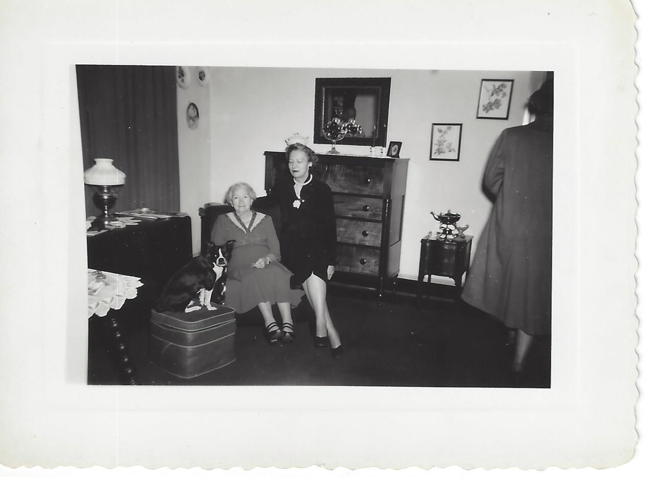Ollie in the parlor with daughter and dog