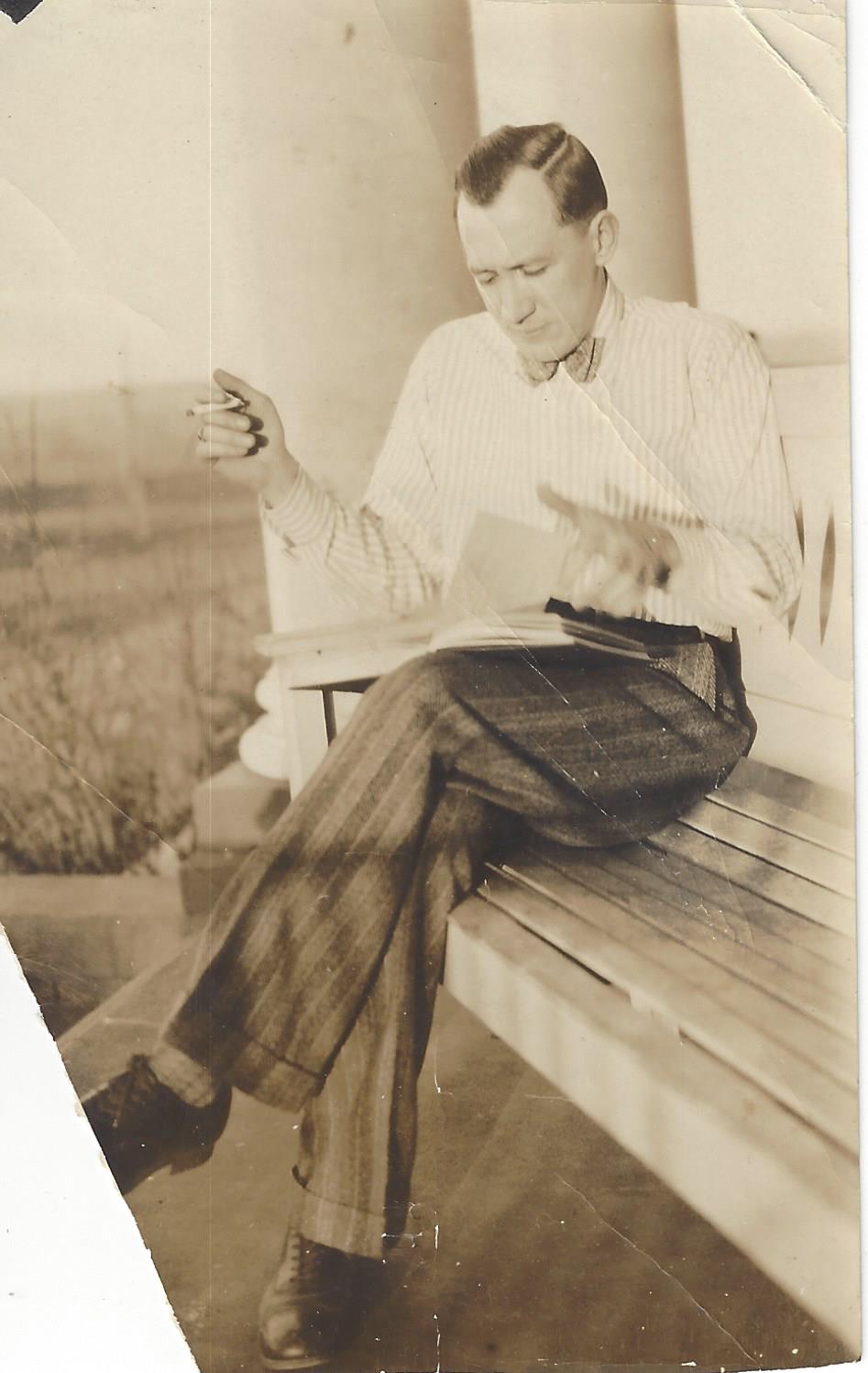 Roger reading on a porch, c. 1930s