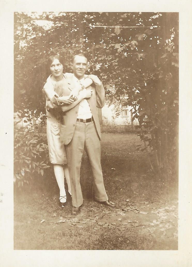 Doc and Virge embracing in the garden