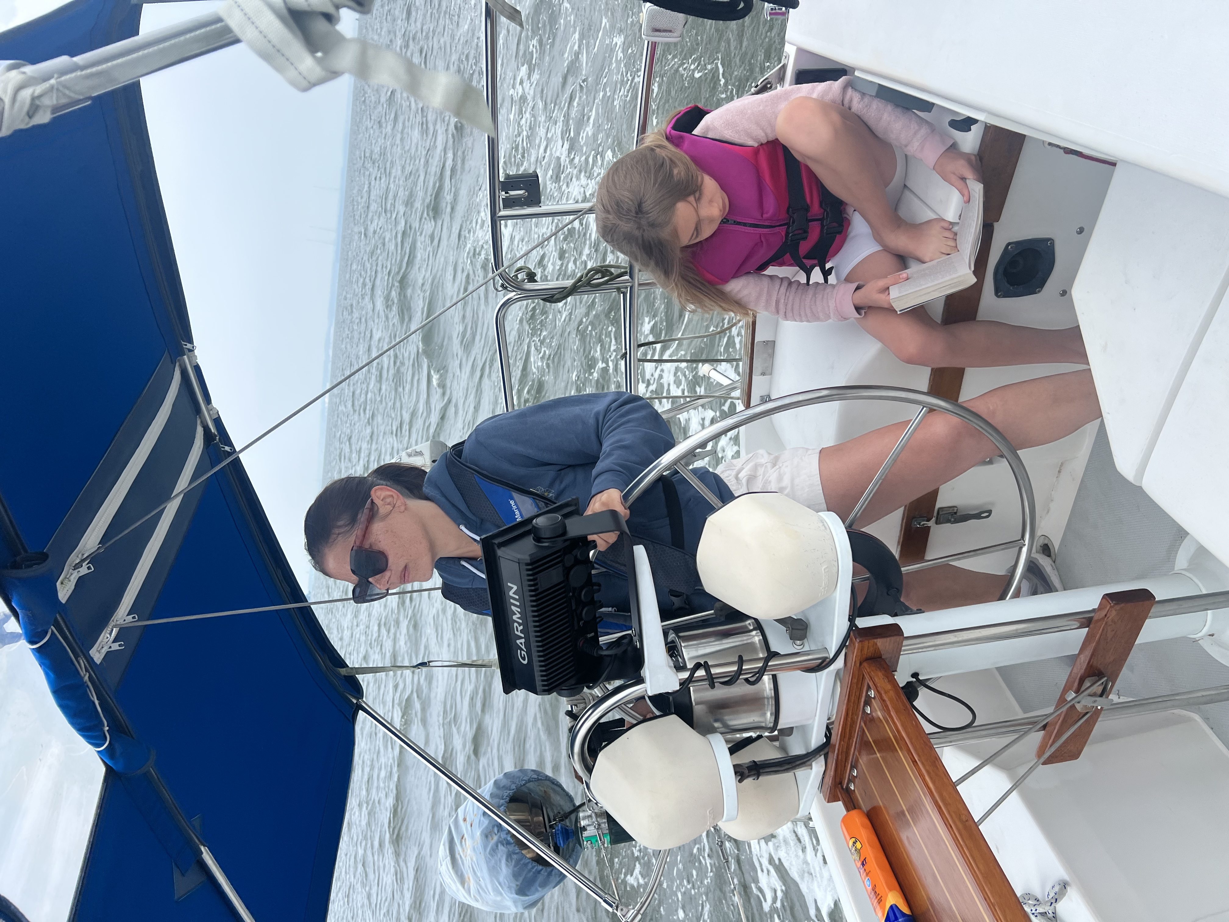 Evelyn at the helm of Seventh Heaven under way on the Chesapeake